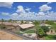 Aerial view of backyard featuring manicured lawn, desert landscaping, patio with seating, and block fence at 3586 S Moccasin Trl, Gilbert, AZ 85297