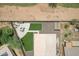 Backyard featuring artificial turf, concrete patio with dining set, and low maintenance desert landscaping at 3586 S Moccasin Trl, Gilbert, AZ 85297