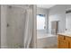 Bathroom with a shower, soaking tub, and white marble tiling throughout at 3586 S Moccasin Trl, Gilbert, AZ 85297