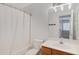 Bright bathroom featuring a shower-tub combination and a vanity with a large mirror at 3586 S Moccasin Trl, Gilbert, AZ 85297