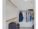 Spacious walk-in closet featuring rods and shelves for ample storage at 3586 S Moccasin Trl, Gilbert, AZ 85297