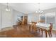 Open concept dining room featuring hardwood floors and abundant natural light at 3586 S Moccasin Trl, Gilbert, AZ 85297