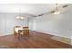 Cozy dining room with hardwood floors, complemented by light grey paint, with neutral decor at 3586 S Moccasin Trl, Gilbert, AZ 85297