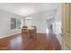 Bright dining room with hardwood floors and elegant chandelier lighting at 3586 S Moccasin Trl, Gilbert, AZ 85297