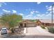 Charming single-story home with manicured front yard and attached two-car garage at 3586 S Moccasin Trl, Gilbert, AZ 85297