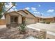 Beautiful single-story home with desert landscaping, a two-car garage, and a cozy porch at 3586 S Moccasin Trl, Gilbert, AZ 85297