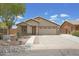 Inviting single-story home featuring desert landscaping and a spacious two-car garage at 3586 S Moccasin Trl, Gilbert, AZ 85297