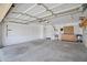 Spacious garage with ample storage, tool boards, and water heater at 3586 S Moccasin Trl, Gilbert, AZ 85297
