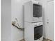Modern laundry room featuring stacked washer and dryer units, offering convenience and space-saving design at 3586 S Moccasin Trl, Gilbert, AZ 85297