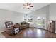 Bright living room with vaulted ceiling, hardwood floors, a comfortable sofa, and access to the backyard at 3586 S Moccasin Trl, Gilbert, AZ 85297