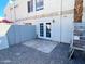 Small backyard patio area with double doors and gravel at 3840 N 43Rd Ave # 34, Phoenix, AZ 85031