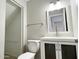 This bathroom includes a toilet, vanity, lighting, mirror and towel bar at 3840 N 43Rd Ave # 34, Phoenix, AZ 85031