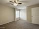Bright bedroom with a ceiling fan and window at 3840 N 43Rd Ave # 34, Phoenix, AZ 85031