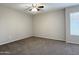 Neutral bedroom featuring carpet and natural light from window at 3840 N 43Rd Ave # 34, Phoenix, AZ 85031