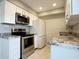 Well-lit kitchen boasts stainless steel appliances and granite countertops, perfect for home cooking at 3840 N 43Rd Ave # 34, Phoenix, AZ 85031