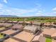 An aerial view of the neighborhood showcasing the home's location and proximity to a lake at 40657 W Somers Dr, Maricopa, AZ 85138