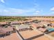 Wide aerial shot of the community shows a single-Gathering home surrounded by desert landscaping at 40657 W Somers Dr, Maricopa, AZ 85138