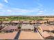 An aerial view of the neighborhood showcasing the home's location and proximity to a lake at 40657 W Somers Dr, Maricopa, AZ 85138