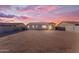 Backyard with expansive space and privacy, ideal for outdoor living and activities at sunset at 40657 W Somers Dr, Maricopa, AZ 85138