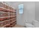 Bathroom with a shower/tub and window at 40657 W Somers Dr, Maricopa, AZ 85138