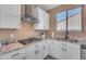 Modern kitchen with stainless steel sink and fixtures at 40657 W Somers Dr, Maricopa, AZ 85138