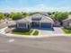Beautiful single-story home with a well-manicured lawn, two-car garage, and easy access to local amenities at 4236 S John Way, Chandler, AZ 85249