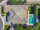 Aerial view showcases a luxurious home with a pristine pool and artificial turf, a perfect outdoor retreat at 4236 S John Way, Chandler, AZ 85249