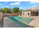 Backyard with a pool, privacy wall and blue skies at 4236 S John Way, Chandler, AZ 85249