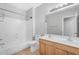 Bright bathroom with double sink vanity, shower and tile floors at 4236 S John Way, Chandler, AZ 85249