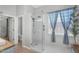 Bright bathroom features a large glass enclosed shower, natural light, and modern fixtures at 4236 S John Way, Chandler, AZ 85249