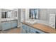 Stylish bathroom with dual sinks, a large mirror, and blue vanity cabinets offer a modern and refreshing design at 4236 S John Way, Chandler, AZ 85249