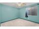 Bedroom with blue walls, carpet flooring, and window with decorative curtains at 4236 S John Way, Chandler, AZ 85249