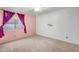 Bright bedroom featuring carpet, pink and white walls, and window with decorative curtains at 4236 S John Way, Chandler, AZ 85249