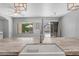 Kitchen view showcasing modern sink and backyard access with patio, umbrella, and green space beyond at 4236 S John Way, Chandler, AZ 85249