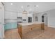 Bright and airy kitchen with island, pendant lighting, and stainless steel appliances creates a welcoming space at 4236 S John Way, Chandler, AZ 85249