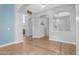 Open-concept living space with decorative tile floors, arched doorways, and modern lighting at 4236 S John Way, Chandler, AZ 85249