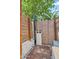 Private outdoor shower with wood accents and brick enclosure provides a refreshing experience at 4236 S John Way, Chandler, AZ 85249