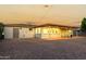 Home exterior shows a covered patio and well-maintained gravel backyard, ready for outdoor enjoyment at 434 N 56Th St, Mesa, AZ 85205
