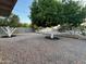 Landscaped backyard with crushed gravel and mature trees, offering a serene outdoor space at 434 N 56Th St, Mesa, AZ 85205