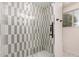 Bathroom shower featuring modern tile and a glass door at 434 N 56Th St, Mesa, AZ 85205