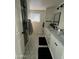 Bright bathroom featuring hexagon tile flooring, a glass shower, and a double sink vanity with marble countertops at 434 N 56Th St, Mesa, AZ 85205