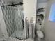 Modern bathroom featuring a glass-enclosed shower, stylish tiling, and elegant fixtures at 434 N 56Th St, Mesa, AZ 85205