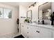Elegant bathroom with double vanity, marble countertop and modern fixtures at 434 N 56Th St, Mesa, AZ 85205