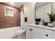 Well-lit bathroom features a tub and shower combination with updated vanity and stylish fixtures at 434 N 56Th St, Mesa, AZ 85205