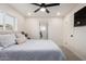 Comfortable bedroom with large window, ceiling fan, and access to the bathroom at 434 N 56Th St, Mesa, AZ 85205