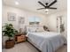 Well-lit bedroom featuring a ceiling fan, window, and neutral decor at 434 N 56Th St, Mesa, AZ 85205