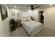 Cozy bedroom featuring a comfortable bed, soft lighting, and minimalist decor at 434 N 56Th St, Mesa, AZ 85205