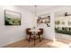 Cozy dining area featuring a marble-topped table, stylish seating, and a decorative display shelf at 434 N 56Th St, Mesa, AZ 85205