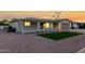 Cozy single-story home featuring a quaint front porch, a well-kept lawn and desert landscaping at 434 N 56Th St, Mesa, AZ 85205