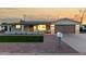 Charming single-story home featuring a quaint porch and a well-maintained front yard at 434 N 56Th St, Mesa, AZ 85205